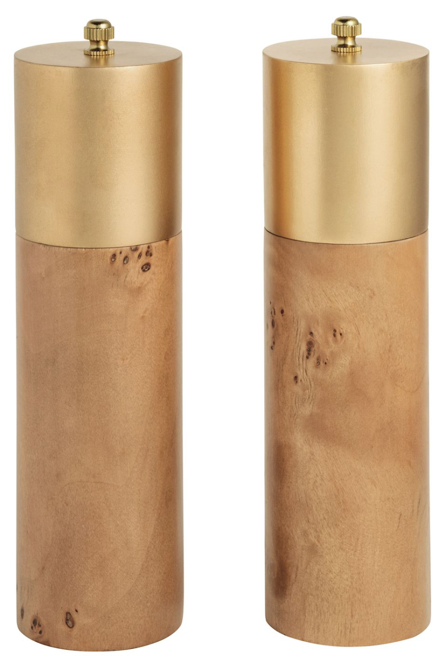 Two cylindrical wooden salt and pepper mills with brushed brass caps and small brass turners, shown side by side on a white background.