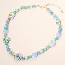 Load image into Gallery viewer, Cute Ceramic Flower Fish Charm Faceted Beaded Statement Necklace